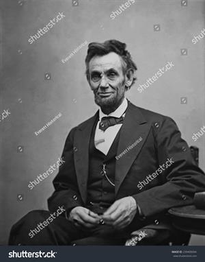 stock-photo-abraham-lincoln-seated-and-holding-his-spectacles-and-a-pencil-on-feb-in-239400094.jpg