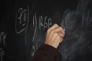 Teacher-writing-on-blackboard564.jpg