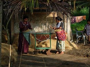 Women_at_work_in_a_small_scale_coir_spinning_unit_at_kollam.jpg